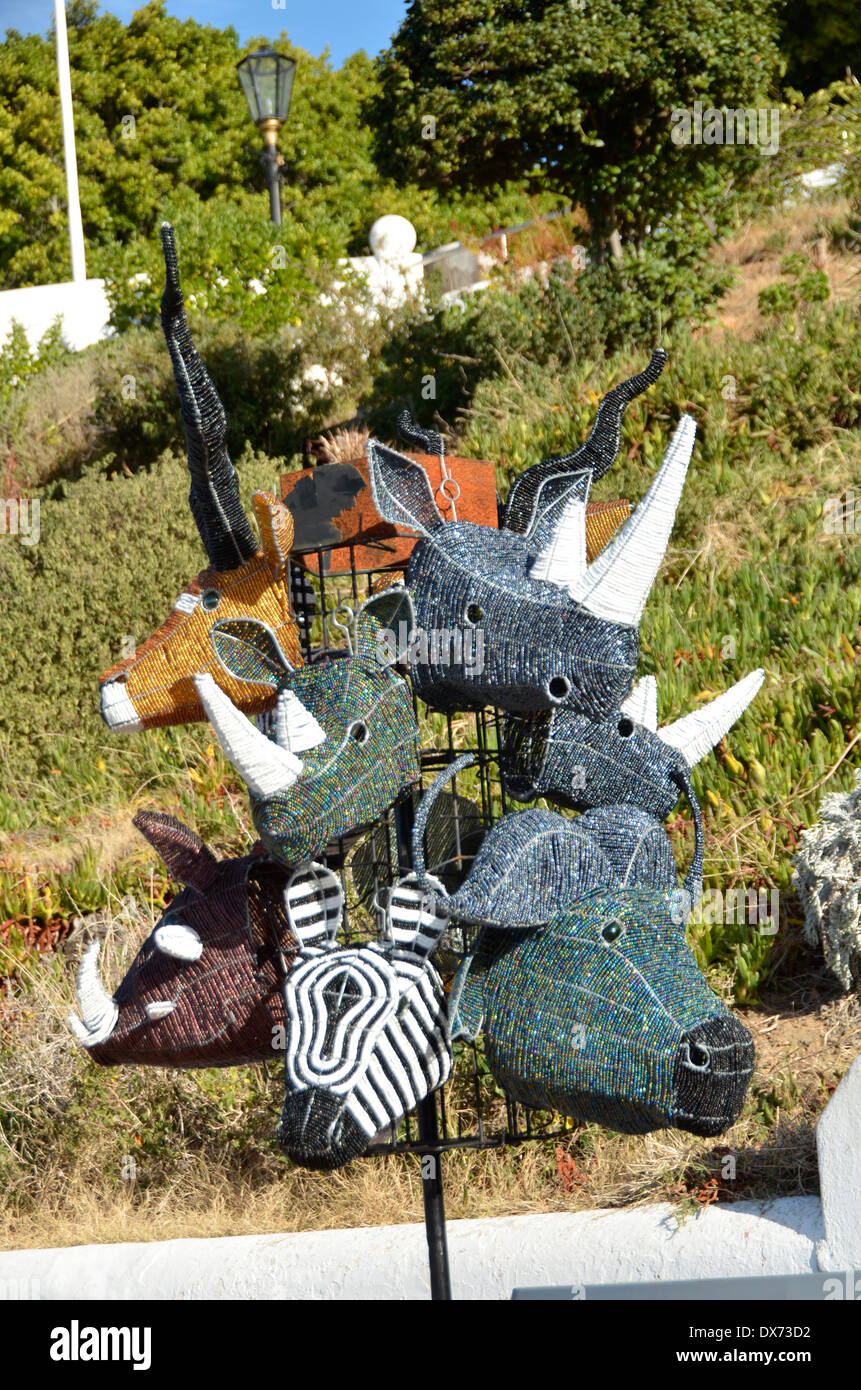 Animal heads hand crafted by local African artists using wire and colored beads, on sale in Simon's Town Stock Photo