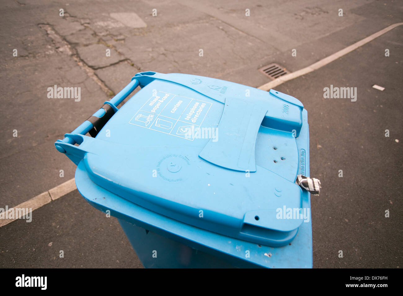 A blue wheelie bin for paper recycling in Manchester Stock Photo Alamy