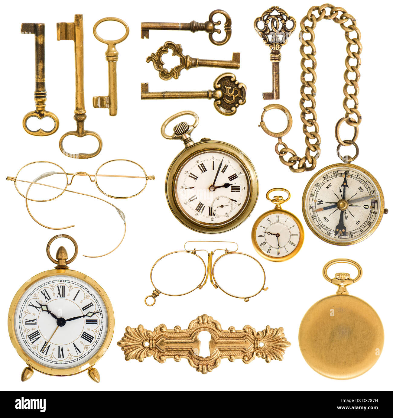 collection of golden vintage accessories. antique keys, clock, compass, glasses isolated on white background Stock Photo