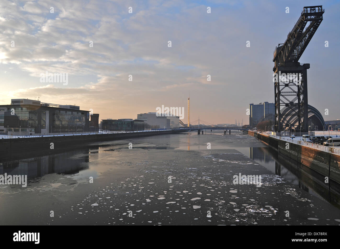 River Clyde partly frozen in Glasgow City Centre. (2010) . Finneston Crane in shot. Stock Photo