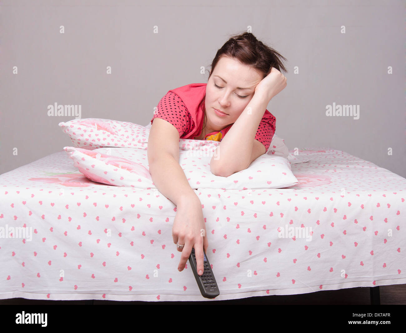 A young girl is Watching TV in bed Stock Photo Alamy
