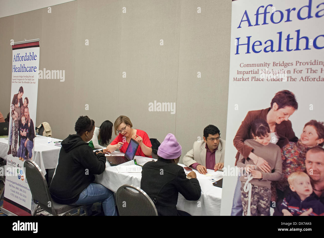 Detroit, Michigan - Health care 'navigators' sign people up for health insurance plans under the Affordable Care Act. © Jim West/Alamy Live News Stock Photo