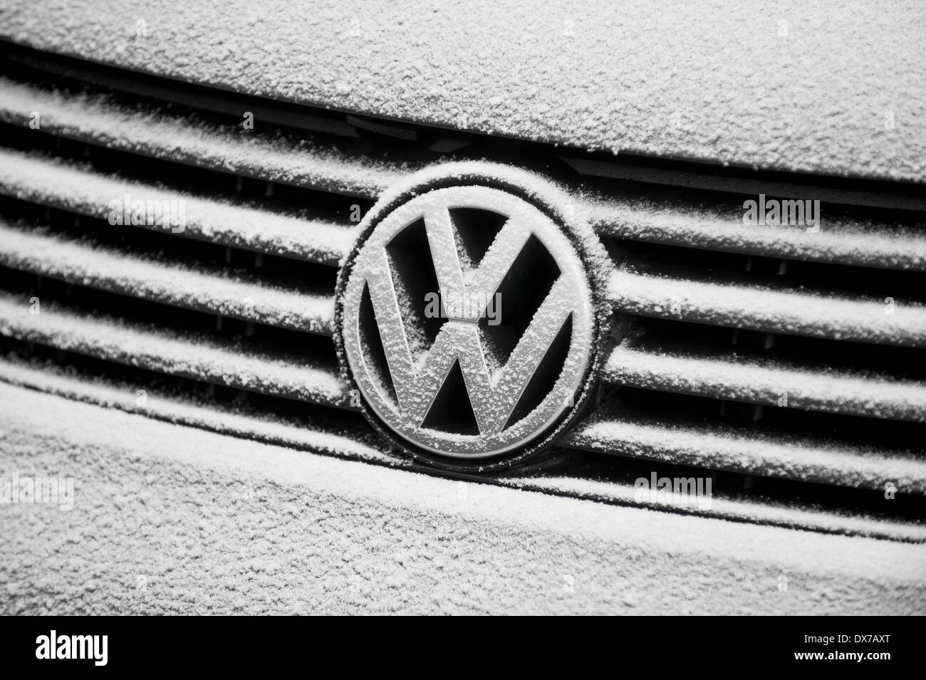 BUCHAREST - FEBRUARY 5: Volkswagen logo is covered with thin layer of fresh snow on February 5, 2014 in Bucharest. Stock Photo