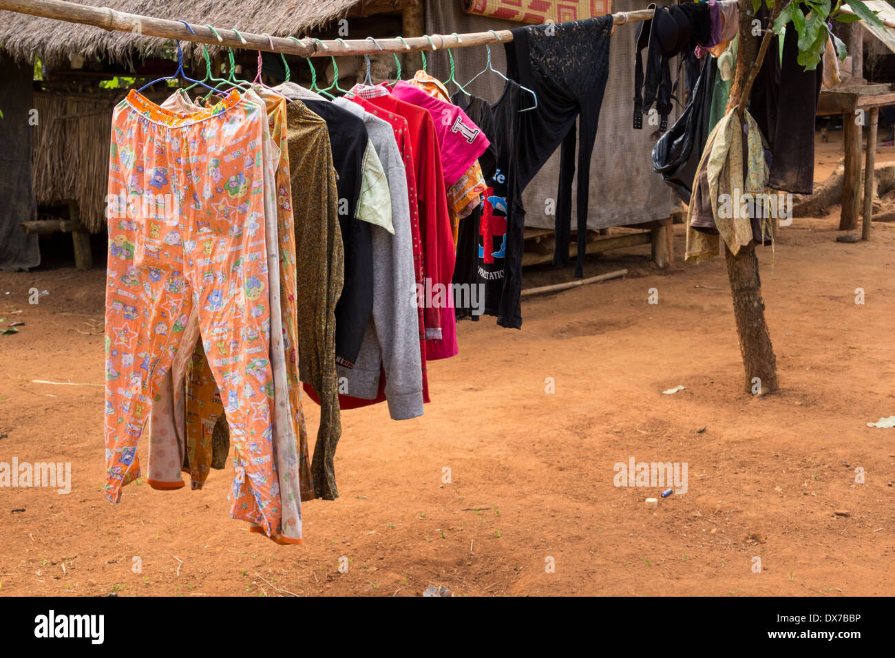 Clothes drying out of a house in Chi Path, Cardamom Mountains, Cambodia Stock Photo
