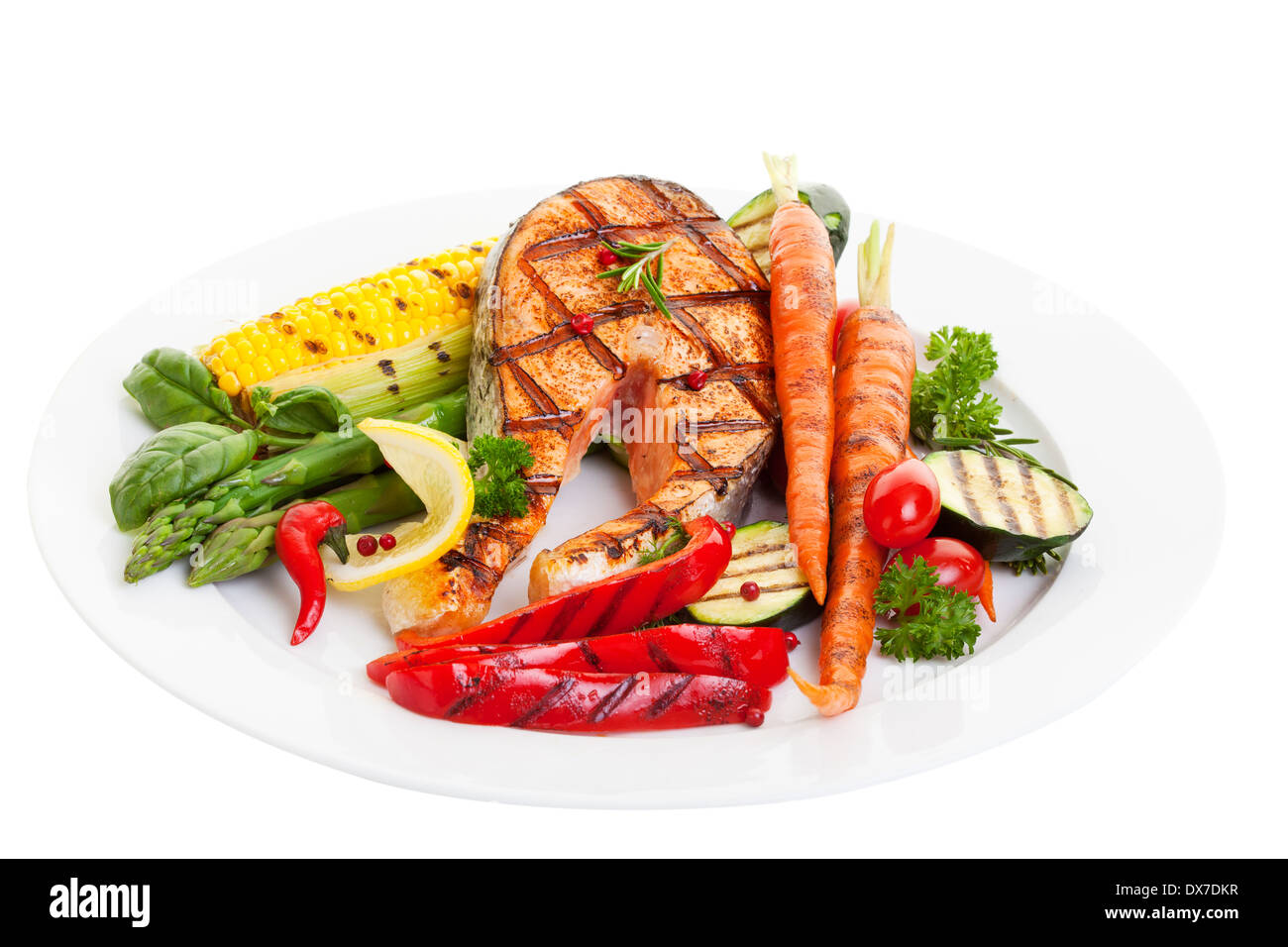Grilled salmon steak with vegetables corn and asparagus Stock Photo