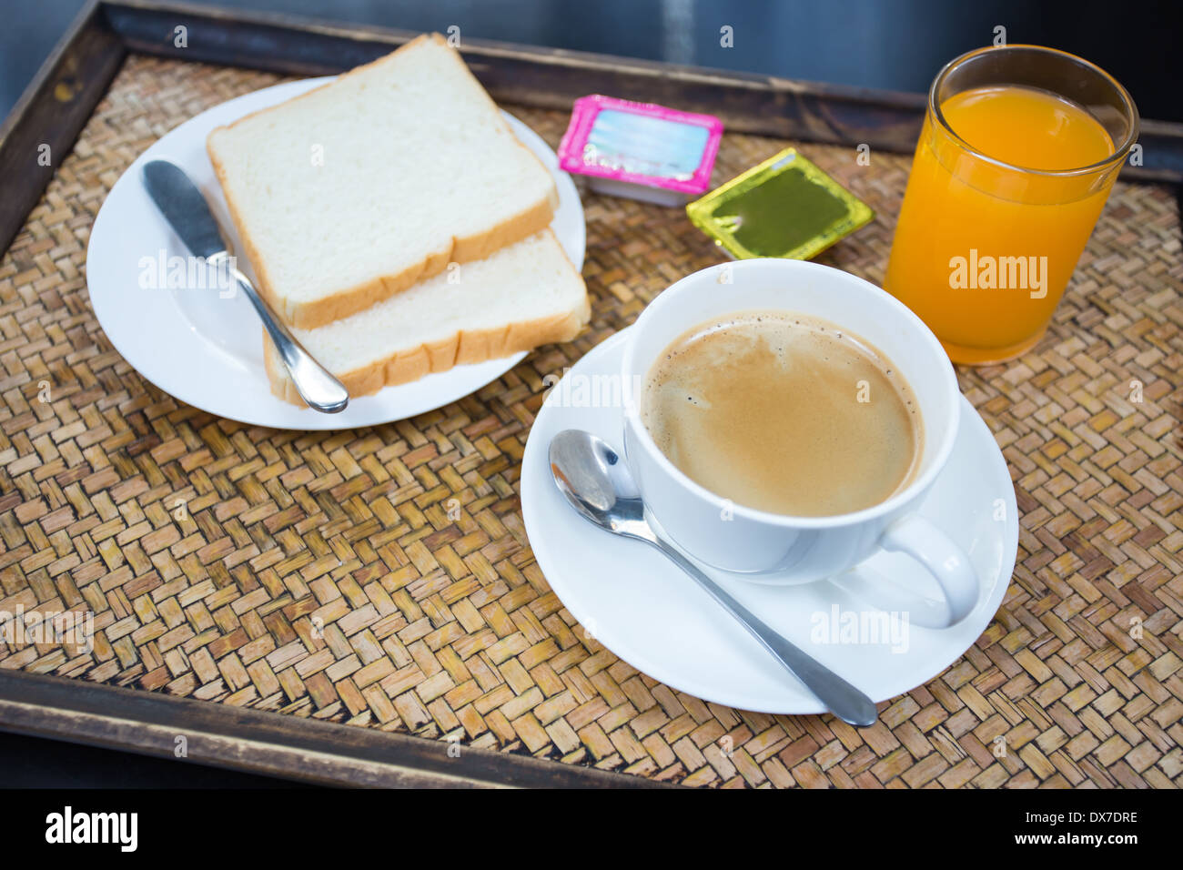 American Breakfast breads with butter,jam, coffee and orange juice in