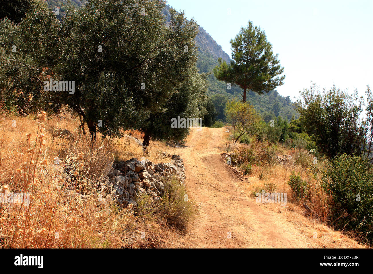 A view of a rocky path along the Lycian way which overlooks Oludeniz in Turkey Stock Photo