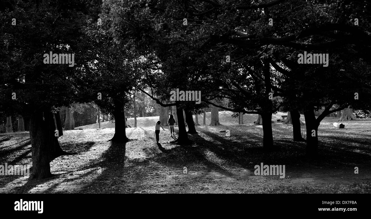 Two girls park rear view Black and White Stock Photos & Images - Alamy