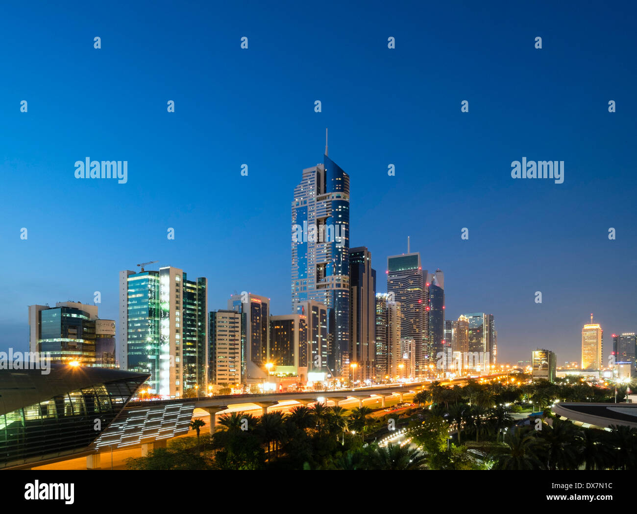 Dusk view of skyline of skyscrapers along Sheikh Zayed Road in Dubai United Arab Emirates Stock Photo