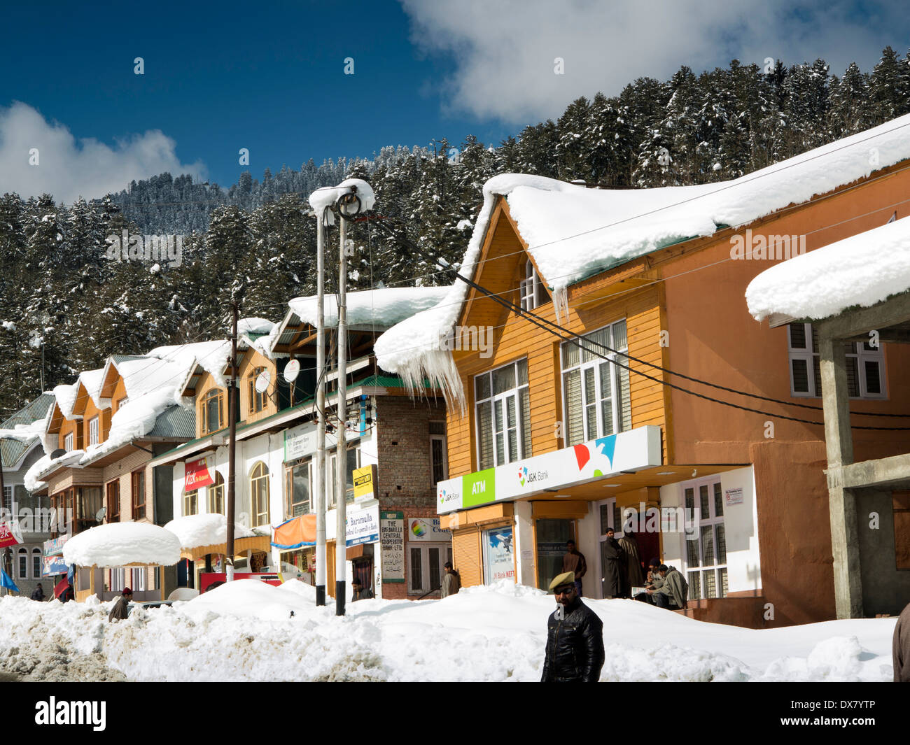 India, Kashmir, Tangmarg bazaar, heavy snowfall on shops and Jammu & Kashmir Bank Stock Photo