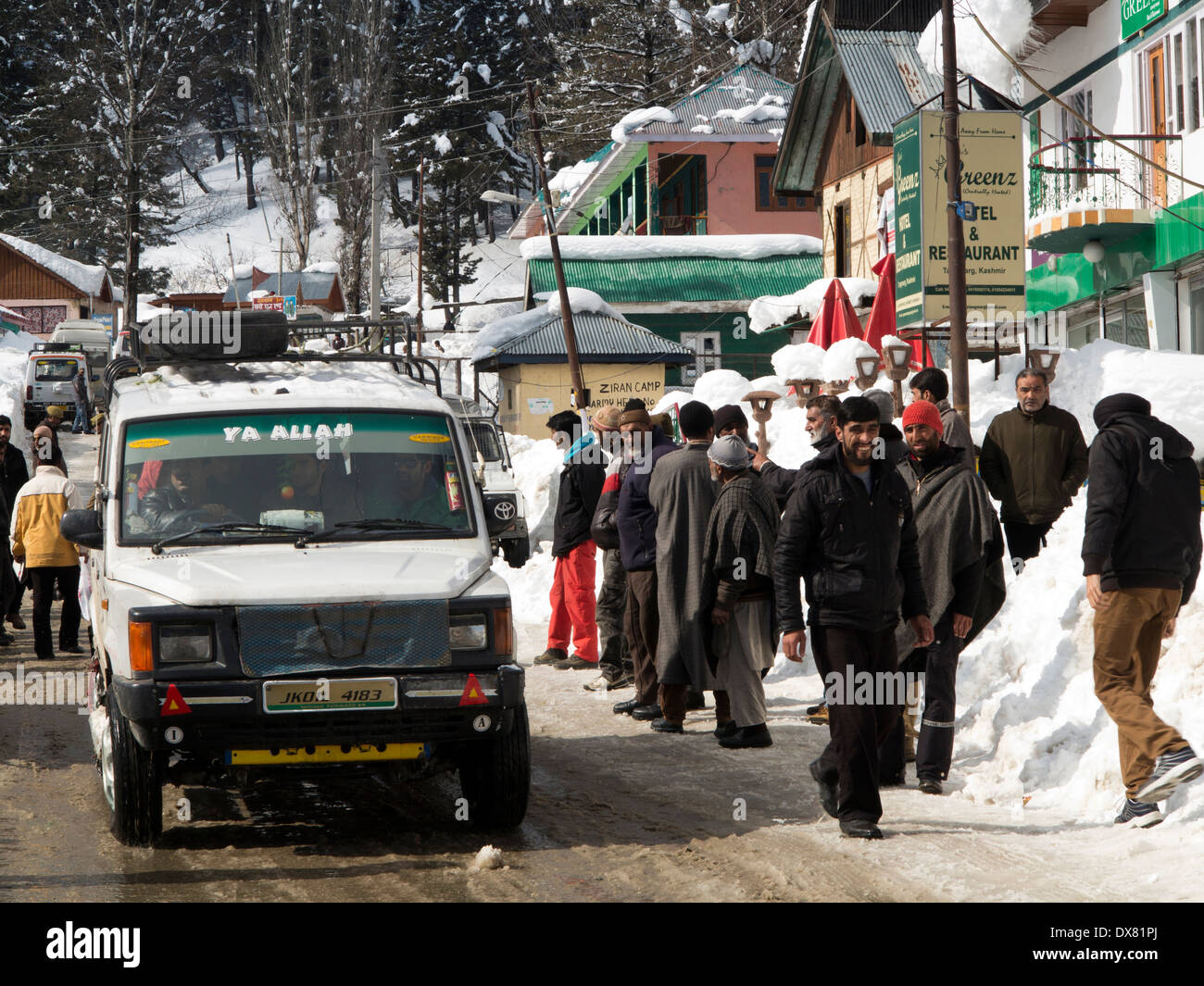 India, Kashmir, Tangmarg bazaar, share taxi drivers and guides waiting