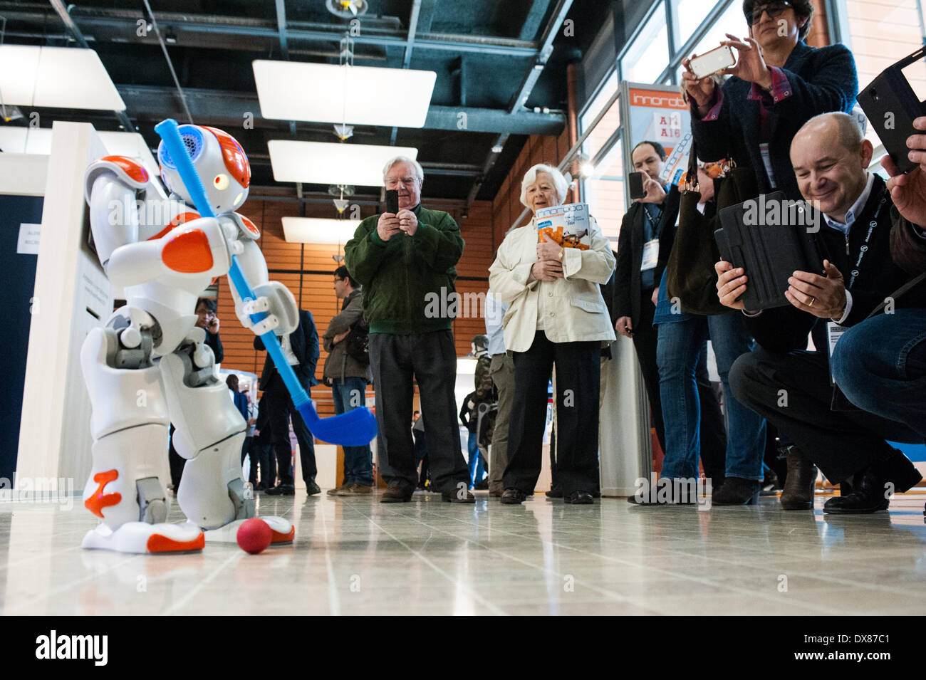 Lyon, France. 19th Mar, 2014. NAO Robot by Aldebaran plays golf at Innorobo 2014, the 4th international trade show on service robotics. Credit:  Piero Cruciatti/Alamy Live News Stock Photo