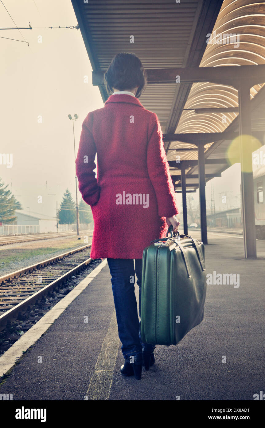 Woman train platform suitcase hi-res stock photography and images - Alamy