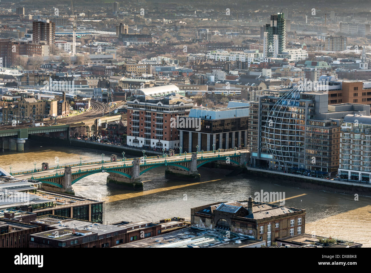 Looking to South East London over Southwark Bridge Cannon Street Railway Bridge spanning the River Thames Stock Photo