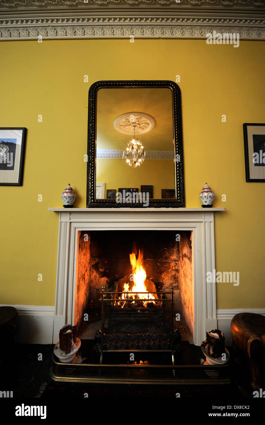 A traditional living room with an open fire in a Georgian townhouse in Bath UK Stock Photo