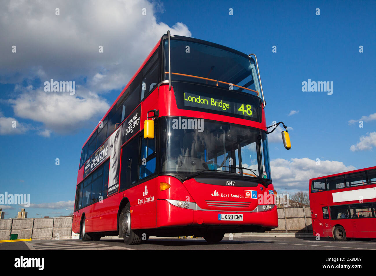 London red bus against a blue sky Stock Photo