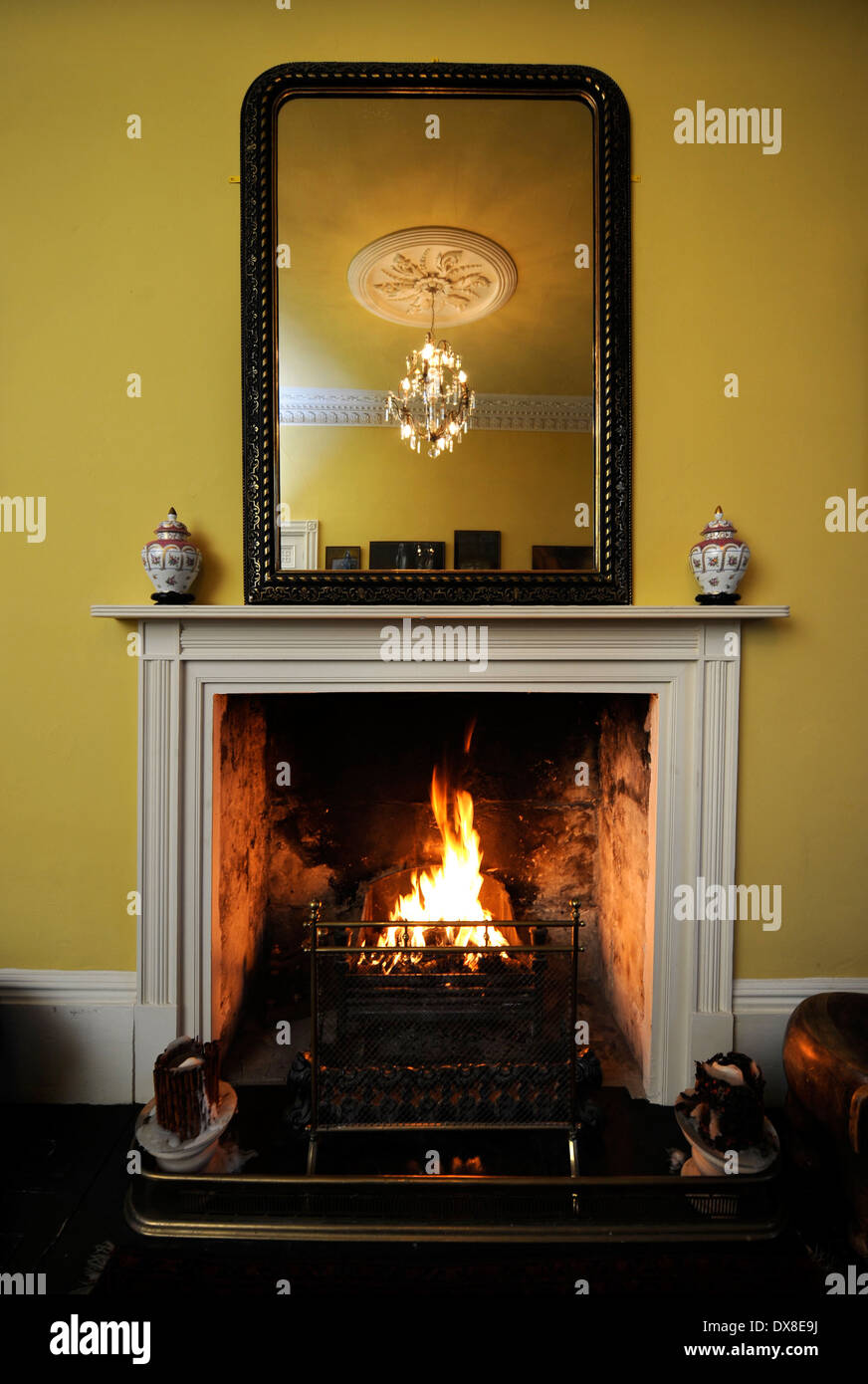 A traditional living room with an open fire in a Georgian townhouse in Bath UK Stock Photo