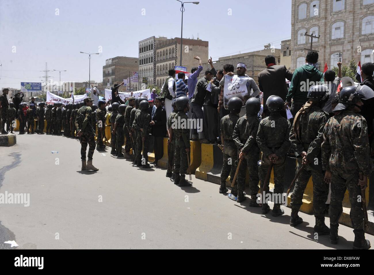 Sanaa, Yemen. 20th Mar, 2014. Yemeni riot police line up to prevent protesters from going near the public prosecution office during a demonstration demanding the prosecution of Yemen's former President Ali Abdullah Saleh, in Sanaa, Yemen, on March 20, 2014. Credit:  Mohammed Mohammed/Xinhua/Alamy Live News Stock Photo