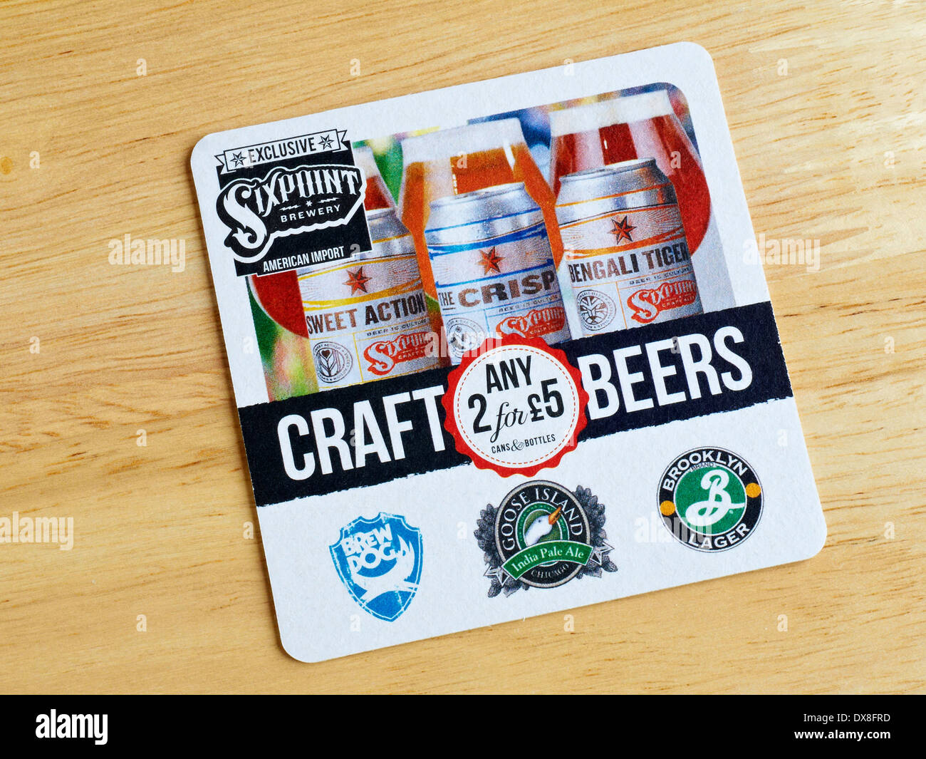Beer mat promoting American beers in the UK Stock Photo Alamy