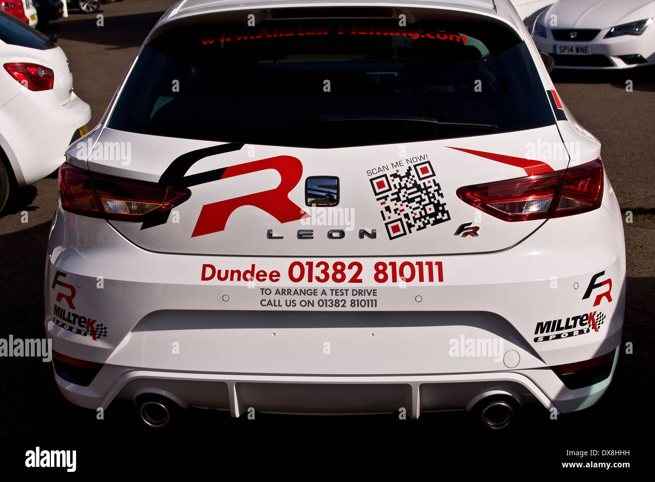A SEAT-Leon sports car with I-Phone application stickers and adverts outside the Alistair Fleming car showroom in Dundee, UK Stock Photo