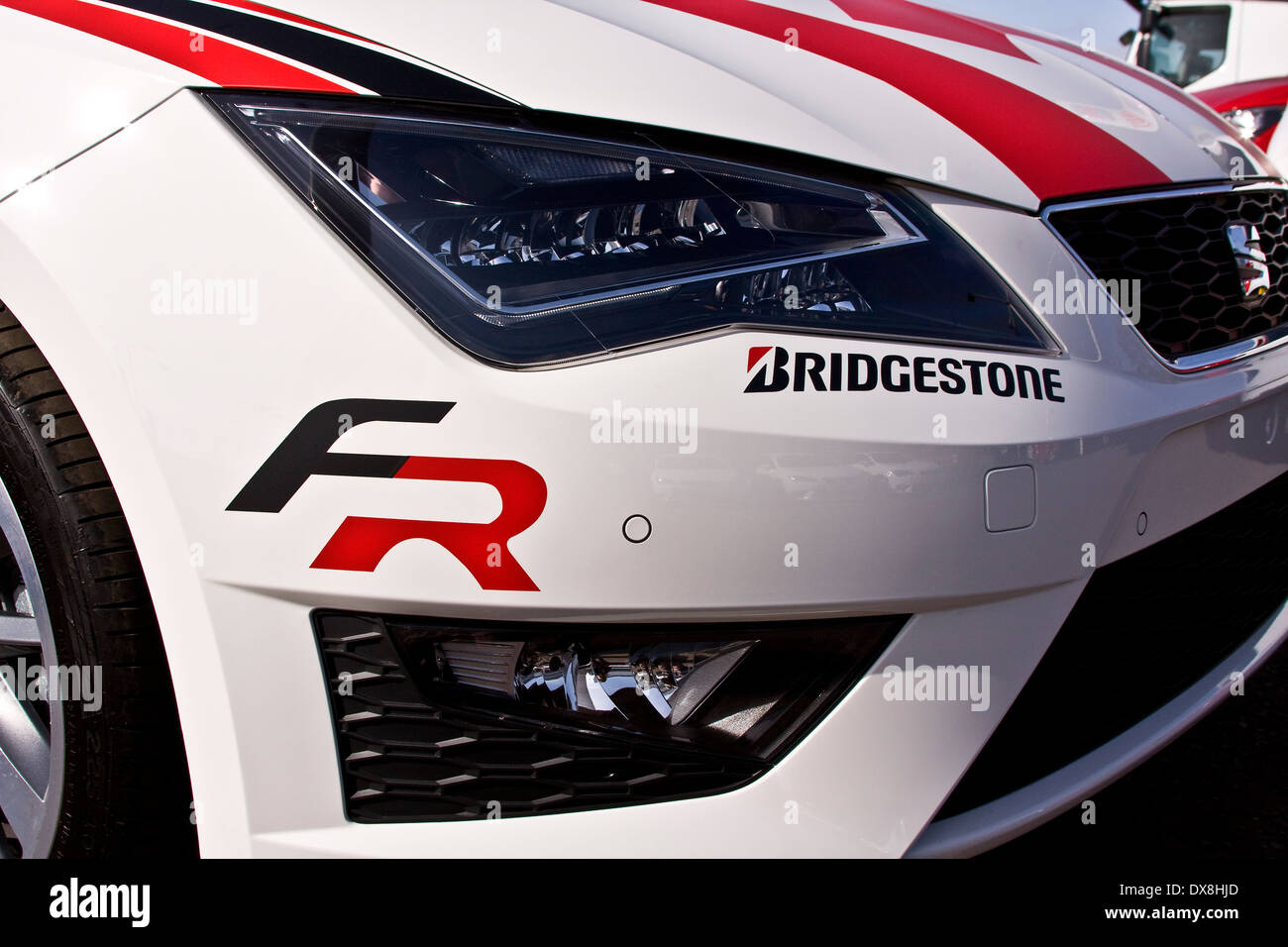 A brand new SEAT-Leon sports car with Bridgestone tyres sticker on the front at the Alistair Fleming car showroom in Dundee, UK Stock Photo