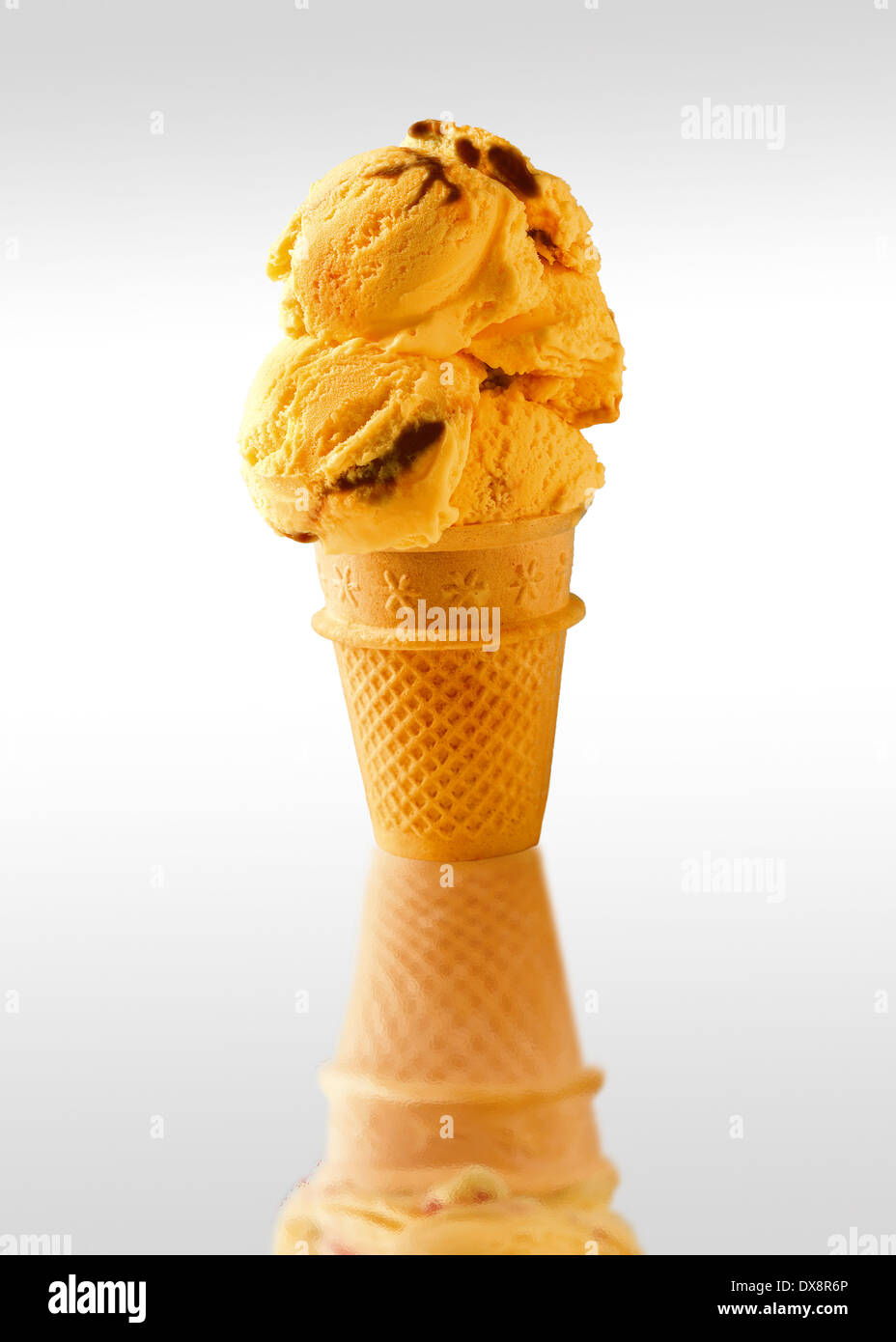 Traditional Cornish vanilla Ice cream chocolate ripple  scoops served cold in a wafer cone Stock Photo