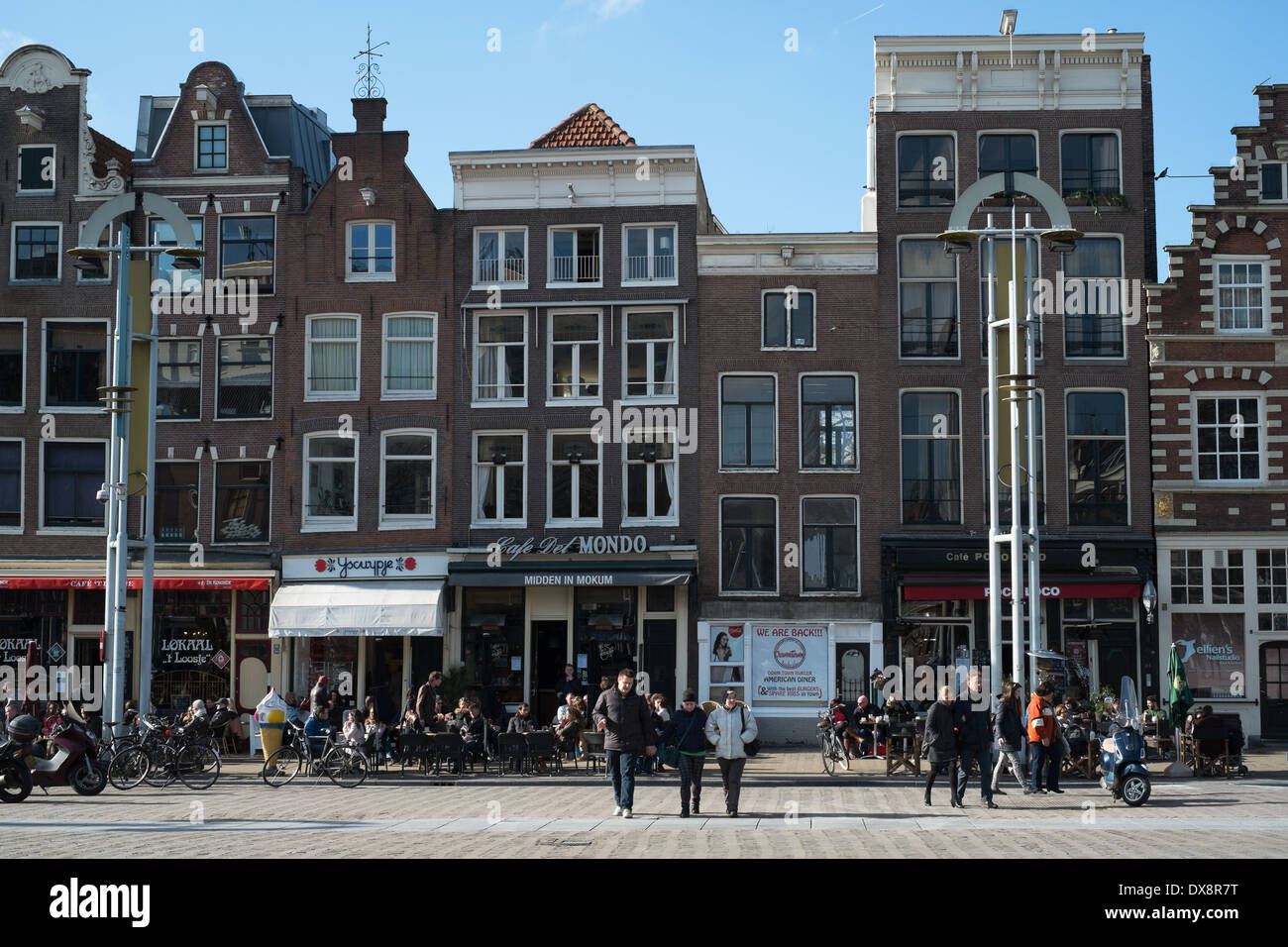 A row of traditional and modern narrow Amsterdam buildings including cafes, bars and restaurants, Holland, the Netherlands Stock Photo