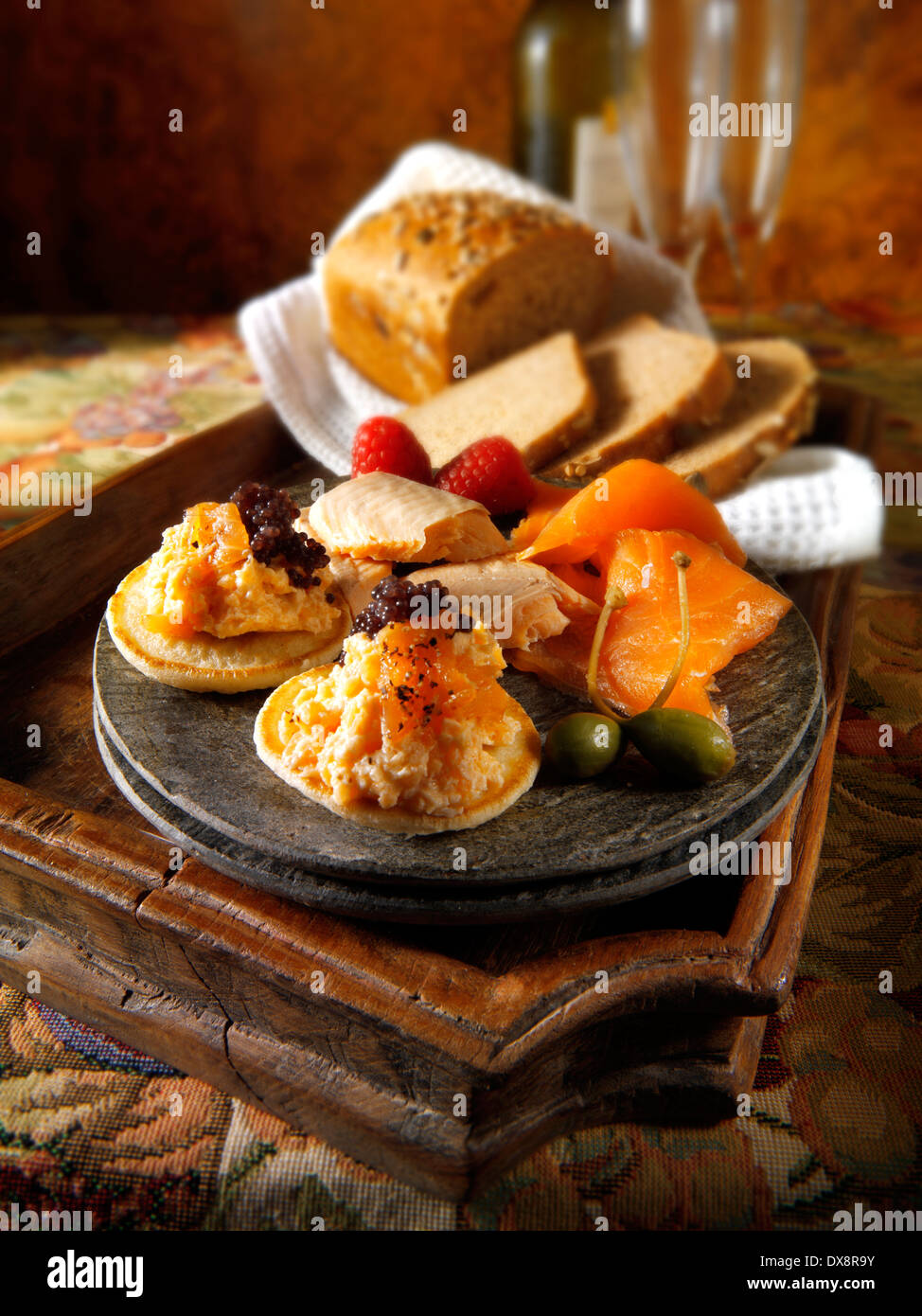 smoked salmon and scrambled egg on brown bread Stock Photo