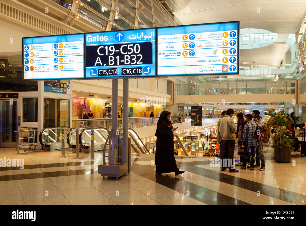 Departure board and gates, Dubai airport departure lounge, UAE, United Arab Emirates, Middle East Stock Photo
