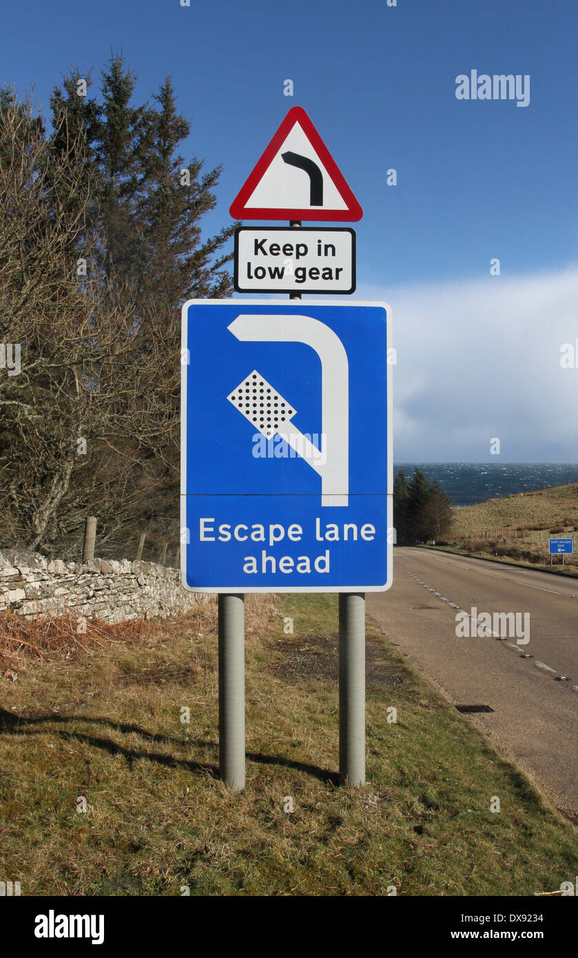 Sign for escape lane on steep hill on A9 near Berriedale Scotland March ...