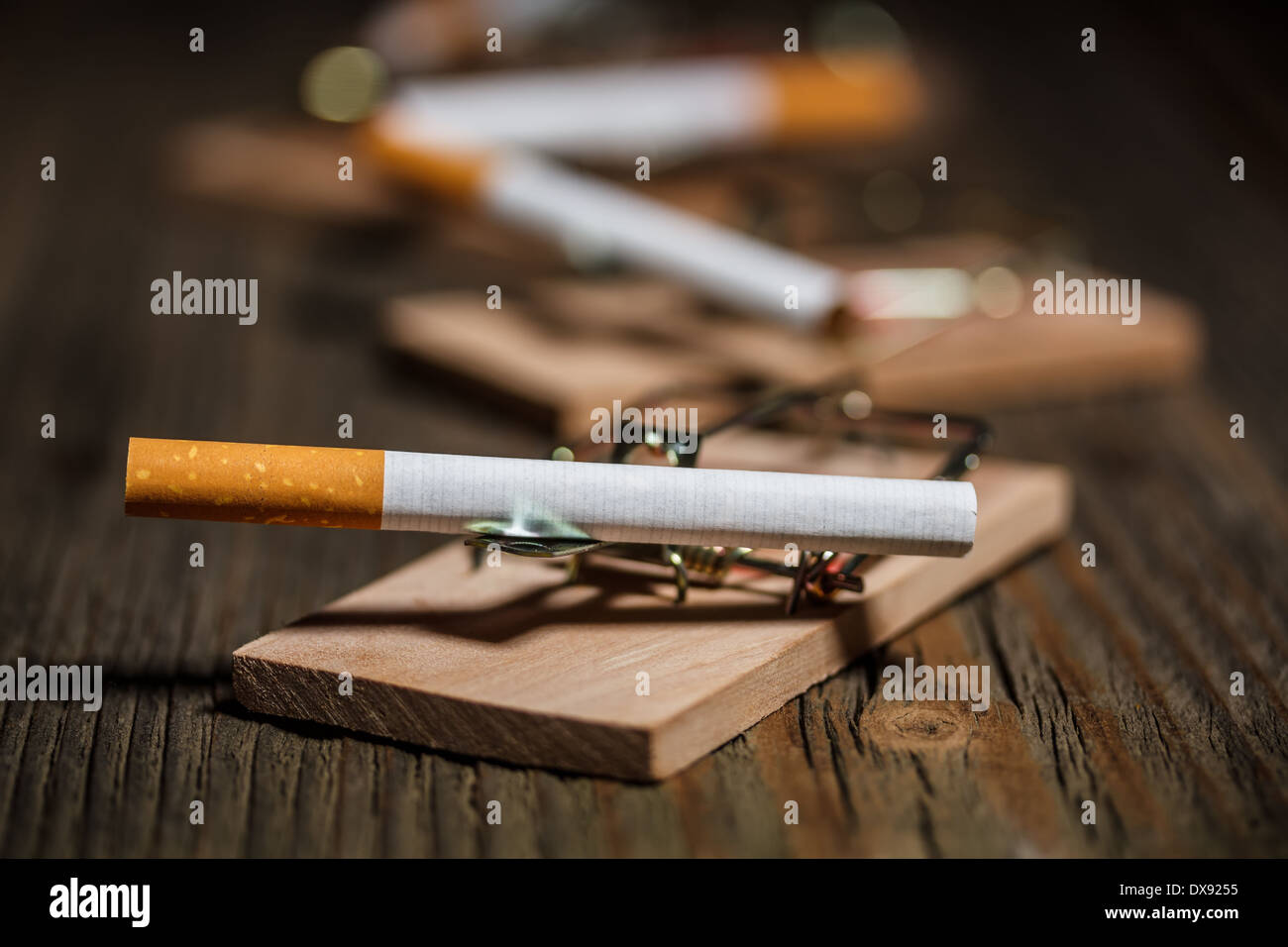 Close up of cigarette in mousetrap Stock Photo