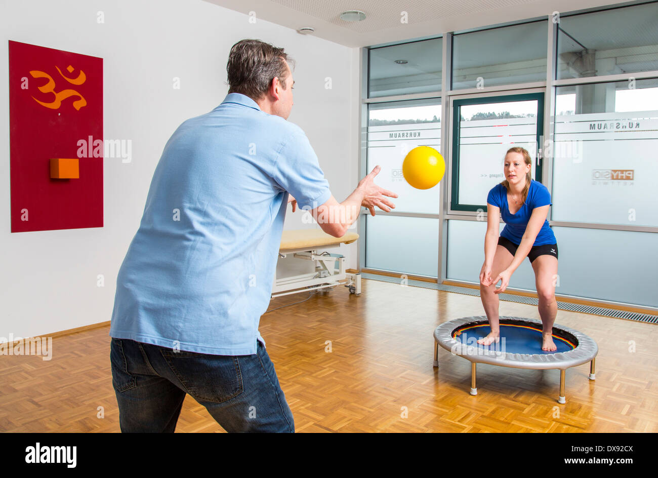 Physiotherapy practice therapist with patient exercise for knee