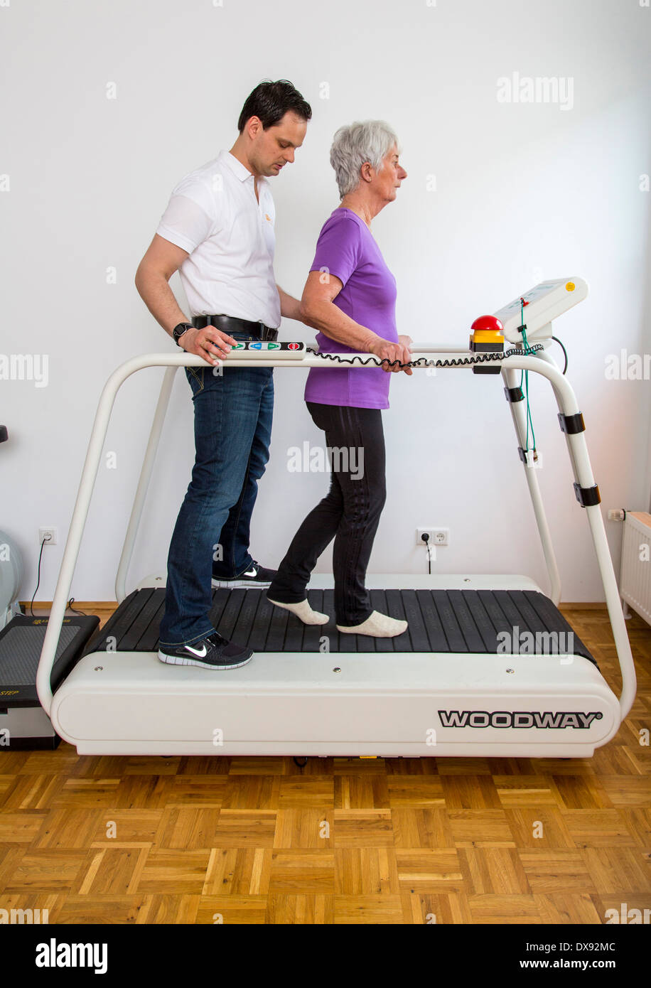 Physiotherapy practice therapist with patient, gait training, running