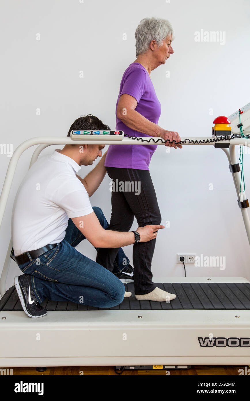 Physiotherapy practice therapist with patient, gait training, running