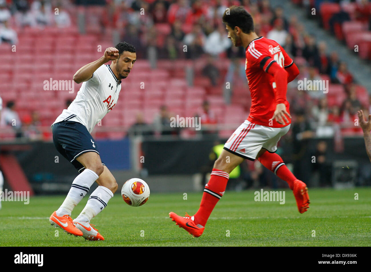 Benfica, Portfugal. 20th Mar, 2014. Tottenham's Belgian midfielder Nacer Chadli in action with Benfica's Portuguese midfielder Andre Gomes during the UEFA Europa League round of 16 second leg football match between SL Benfica and Tottenham Hotspur, at Luz Stadium in Lisboa. Credit:  Filipe Amorim/NurPhoto/ZUMAPRESS.com/Alamy Live News Stock Photo