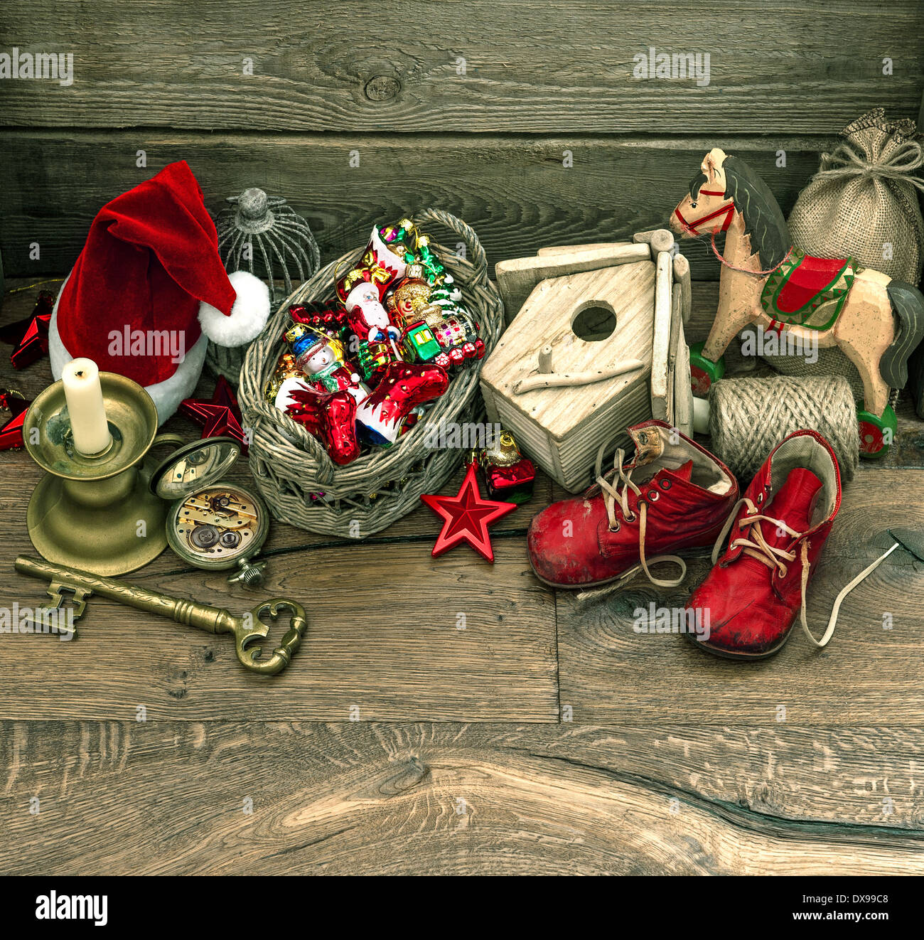 nostalgic christmas decoration with antique toys over wooden background. retro style picture Stock Photo