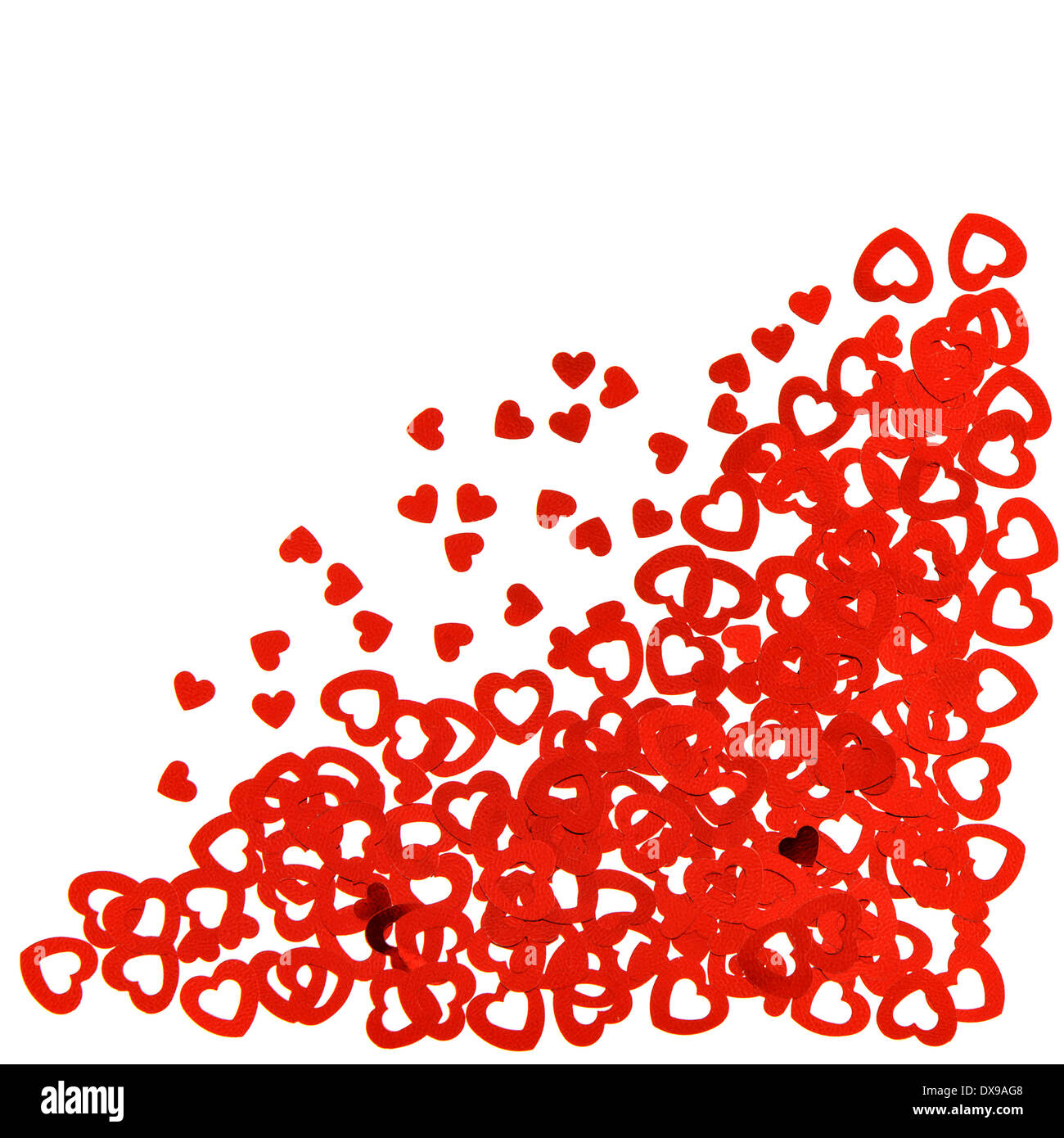 background from red heart shaped confetti. festive decoration Stock Photo