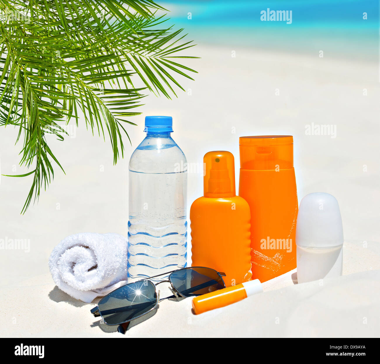 water and sun protection cream on beach background. body care and health care background Stock Photo