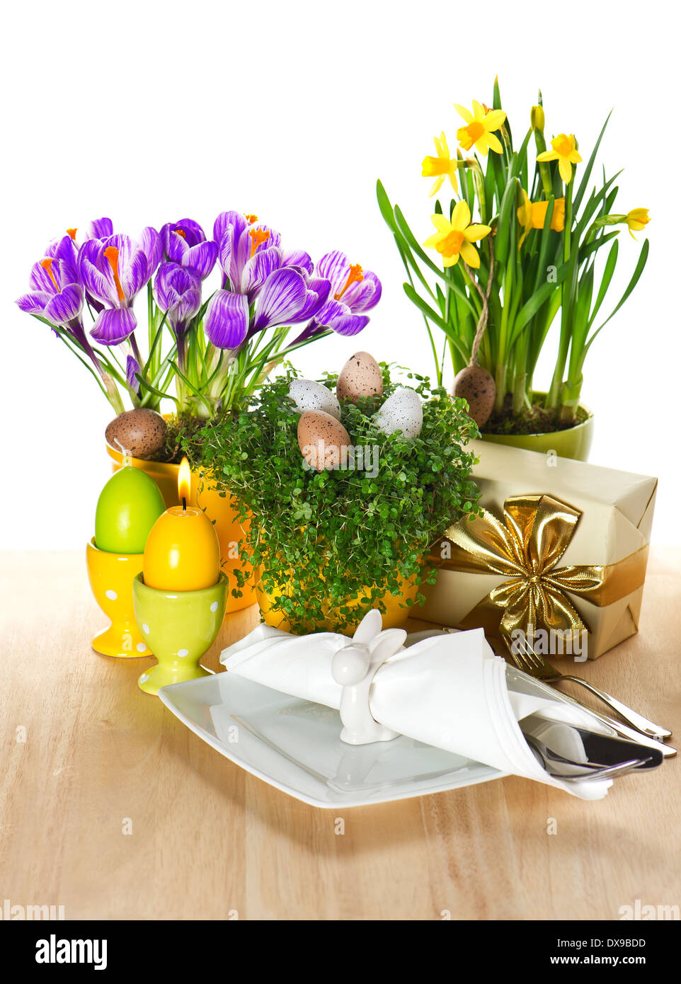 festive easter table setting with spring flowers and eggs decoration on white background Stock Photo