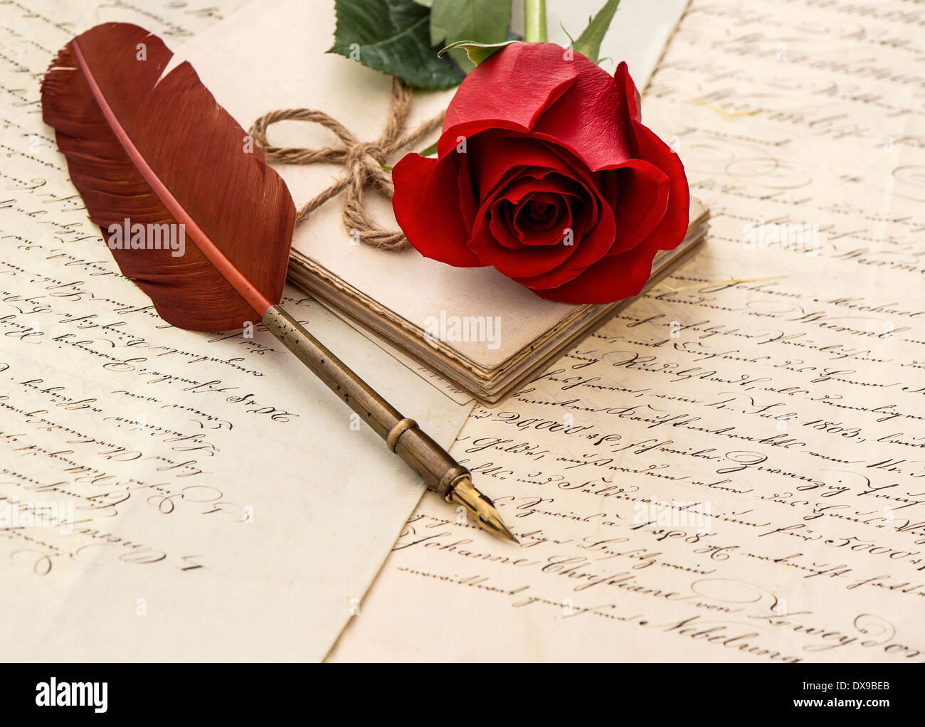 Sentimental Pen red rose flower, old letters and antique feather pen. sentimental ...
