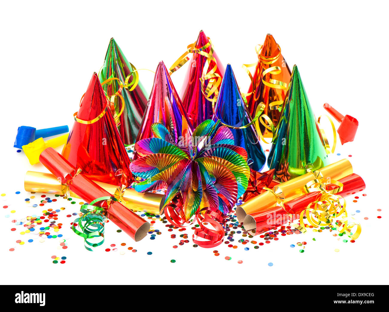colorful garlands, streamer, party hats and confetti on white background. Stock Photo