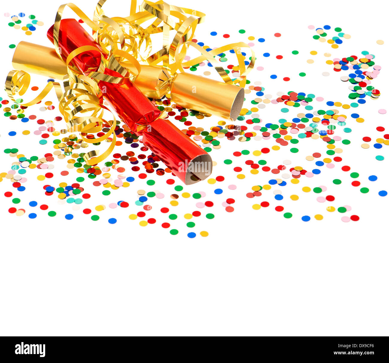 colorful confetti, golden streamer and party cracker over white. festive decoration background Stock Photo