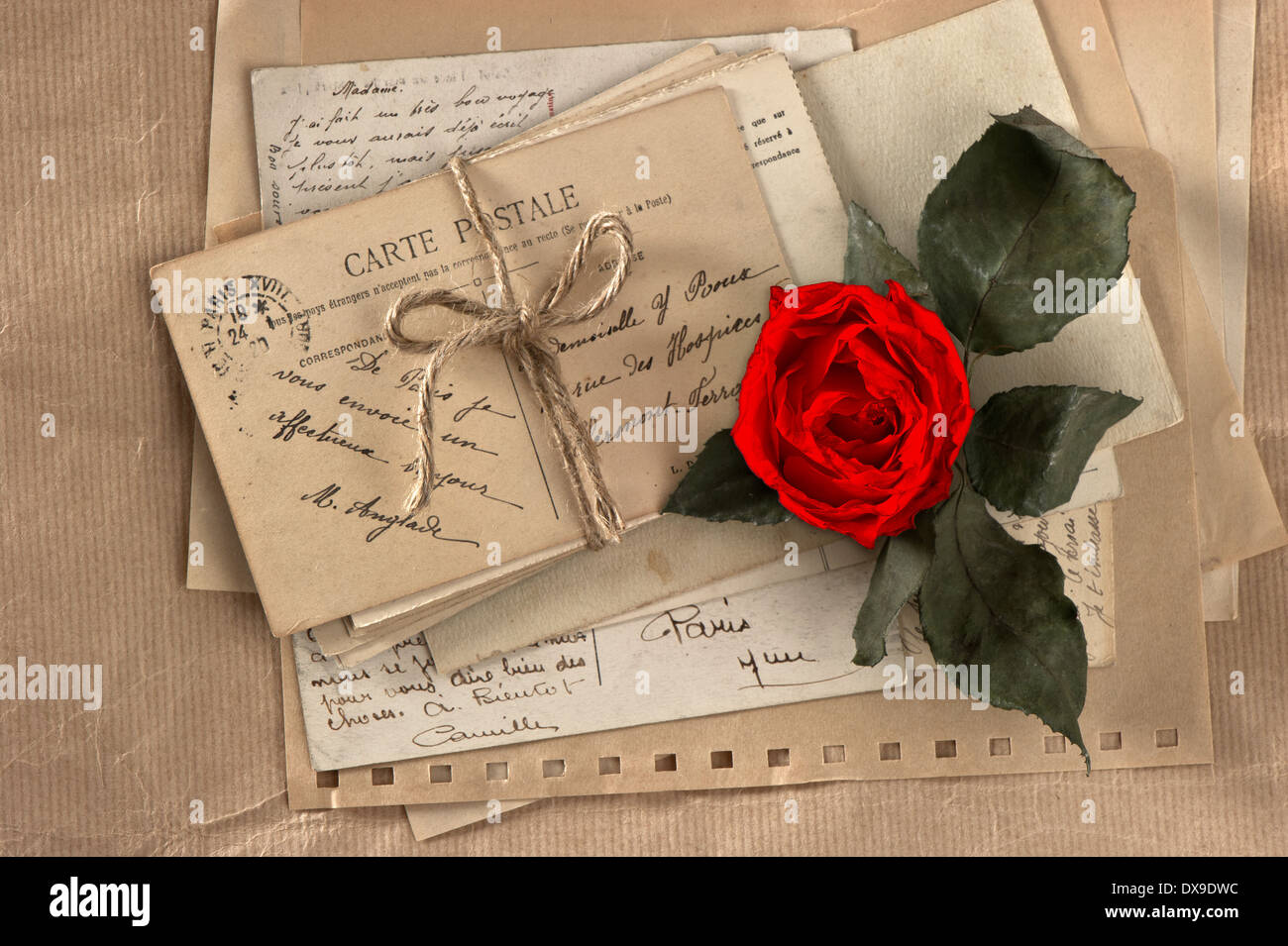 dry red rose and old love letters. vintage postcards and envelopes, vintage valentines day background Stock Photo