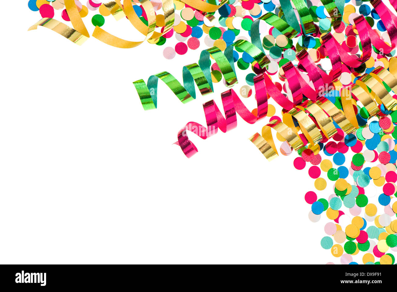 colorful confetti with multicolored streamer over white background. party decoration Stock Photo