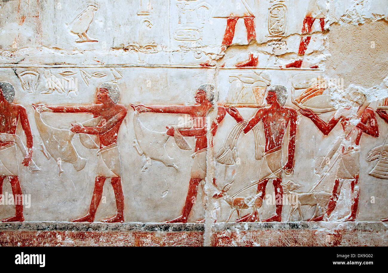 Relief in mastaba Kagemni Saqqara necropolis: men offering various animals Stock Photo