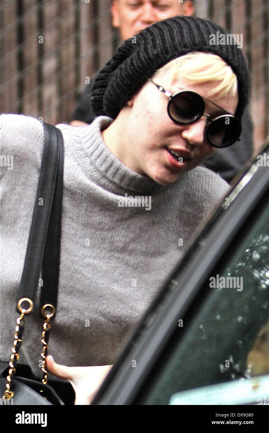 Miley Cyrus shows acne on her face as she leaves a skin care clinic in ...