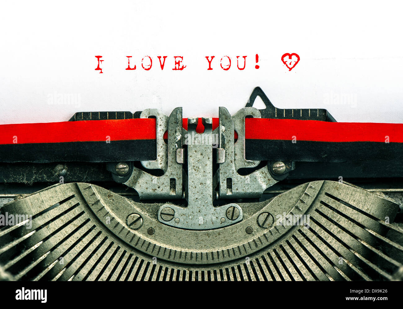 Old typewriter with sample text I LOVE YOU! Red words with heart on