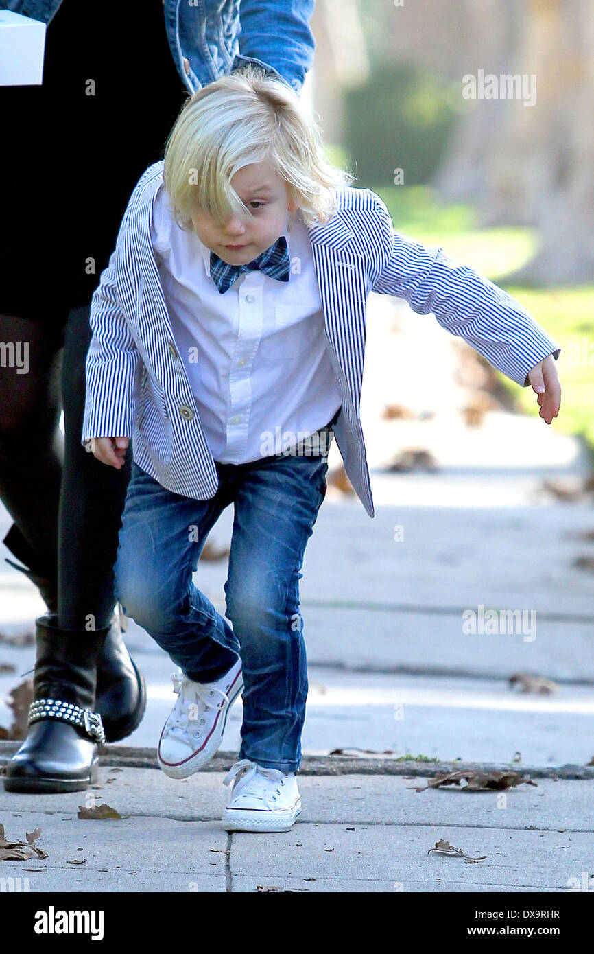 Gwen Stefani's son Zuma in bow tie and a striped suit arrives at his