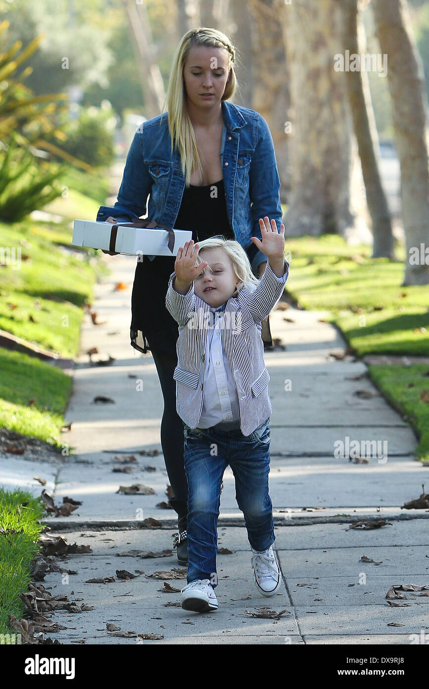 Gwen Stefani's son Zuma in bow tie and a striped suit arrives at his