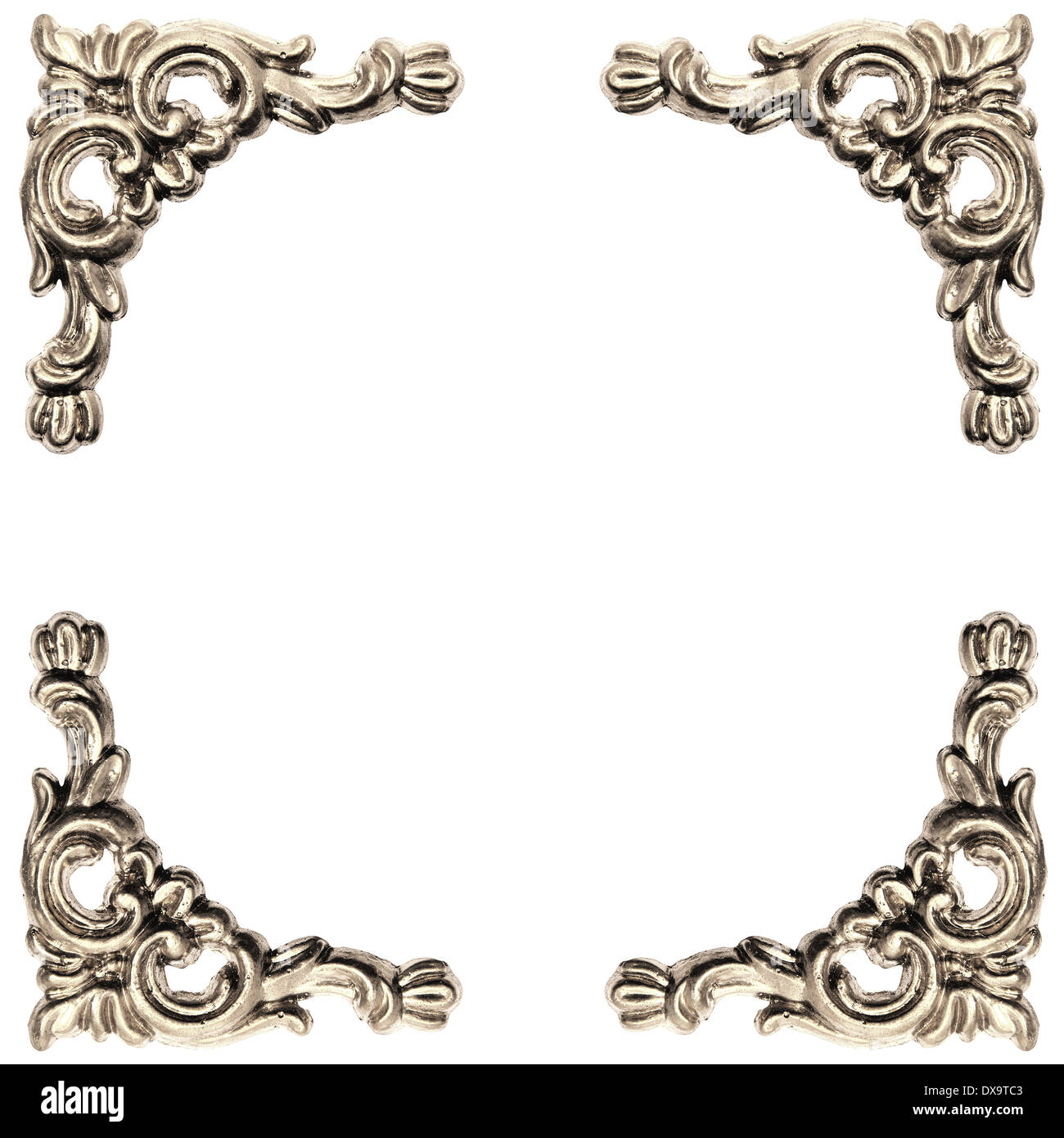 silver colored elements of baroque carved frame on white background with clipping path Stock Photo